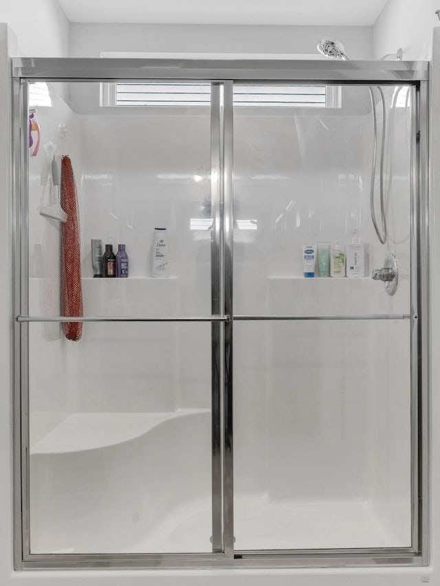 bathroom featuring a healthy amount of sunlight and an enclosed shower