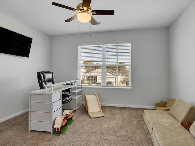 home office with ceiling fan and carpet