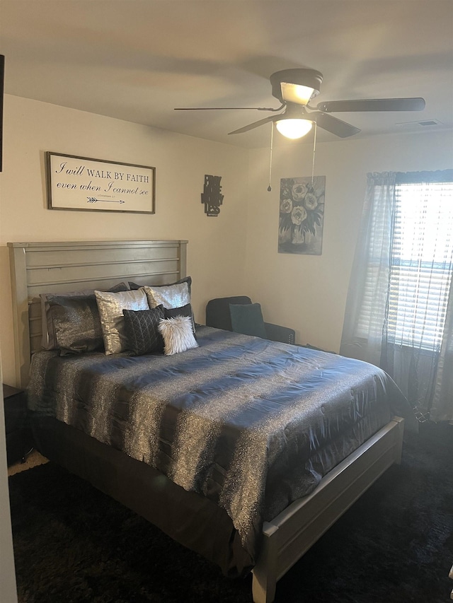 carpeted bedroom featuring ceiling fan