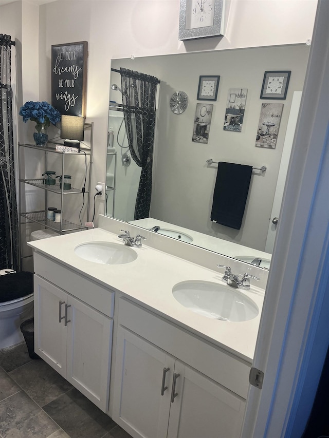 bathroom with vanity and toilet