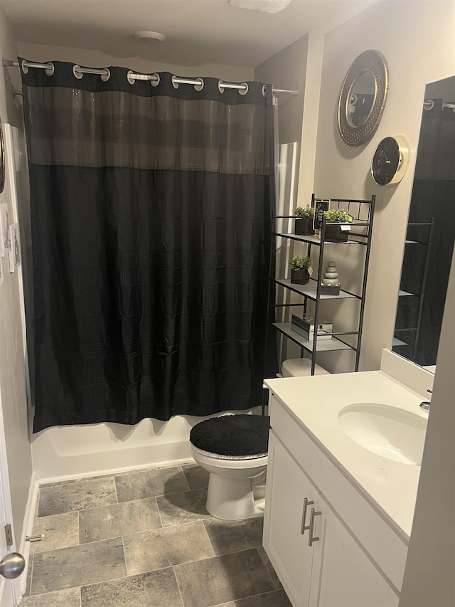 full bathroom with vanity, shower / bath combination with curtain, and toilet