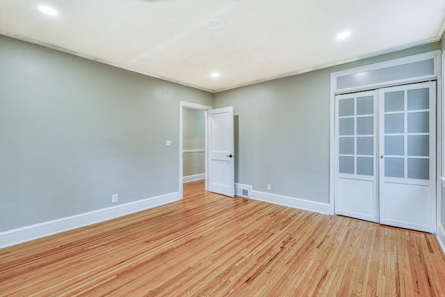 empty room with light hardwood / wood-style floors