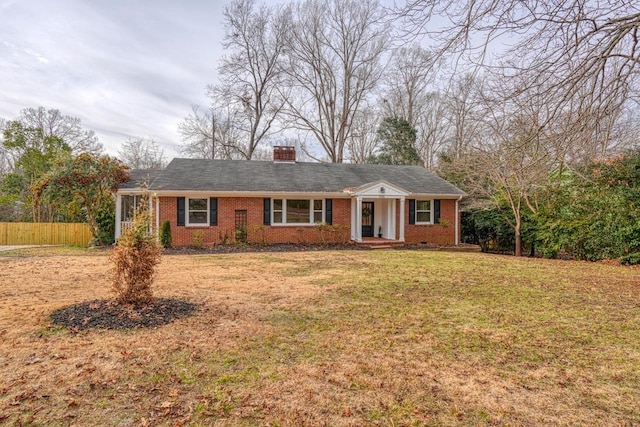 ranch-style home featuring a front yard