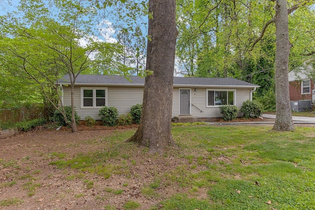 ranch-style home with a front lawn