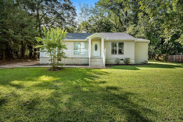 single story home with a front yard and covered porch