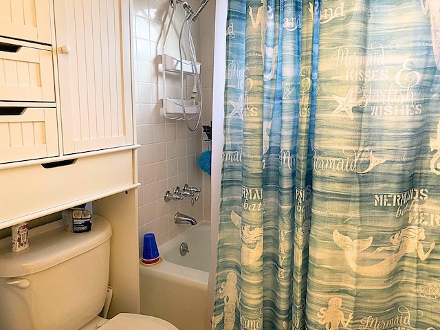 bathroom with shower / bathtub combination with curtain and toilet