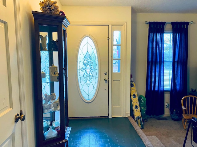 foyer featuring a textured ceiling