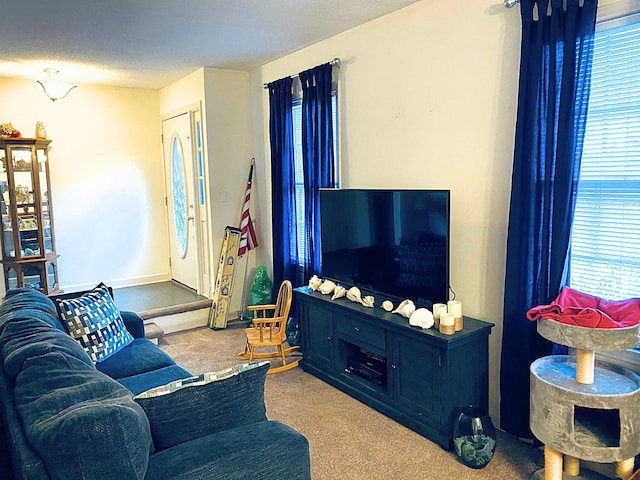 carpeted living room featuring a textured ceiling