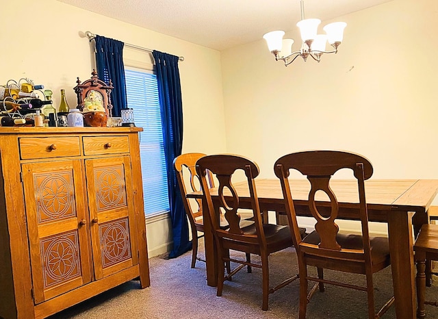 carpeted dining room featuring an inviting chandelier