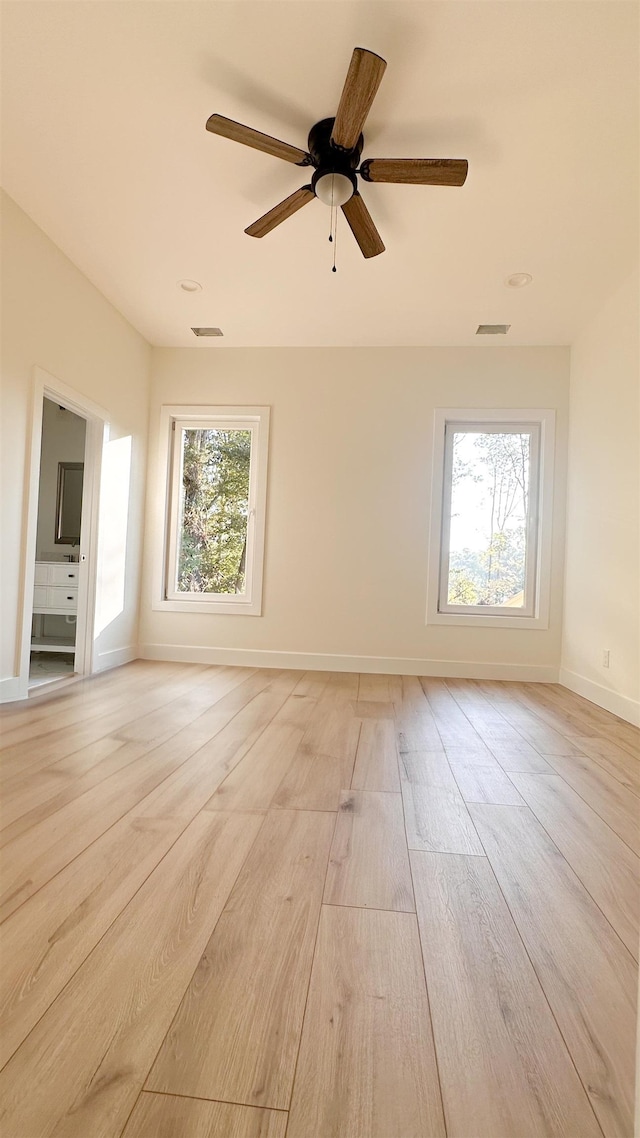 spare room with ceiling fan and light hardwood / wood-style flooring