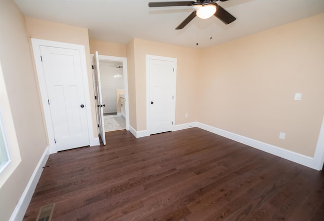 unfurnished bedroom with dark hardwood / wood-style floors and ceiling fan