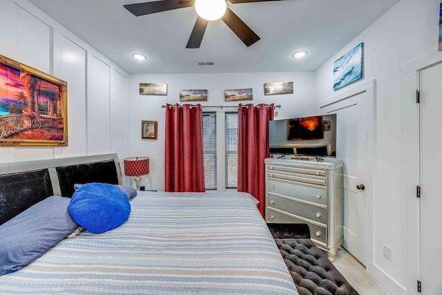 bedroom featuring ceiling fan and light hardwood / wood-style flooring