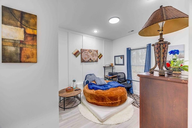 living area with light hardwood / wood-style flooring