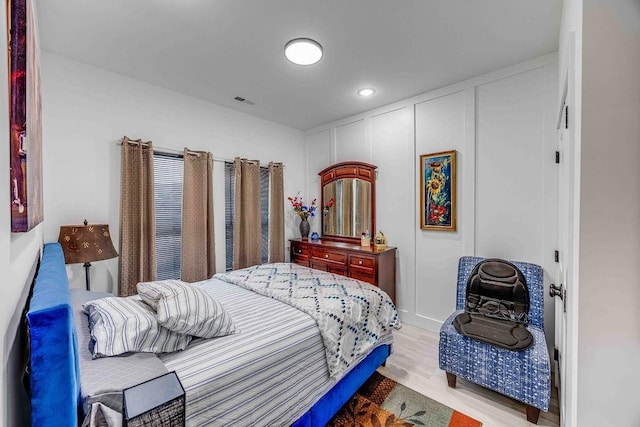 bedroom with light wood-type flooring