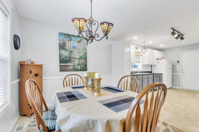 dining room featuring a chandelier