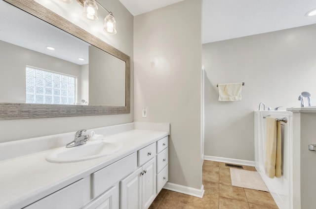 bathroom featuring tile patterned floors and vanity