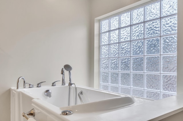 bathroom with a tub