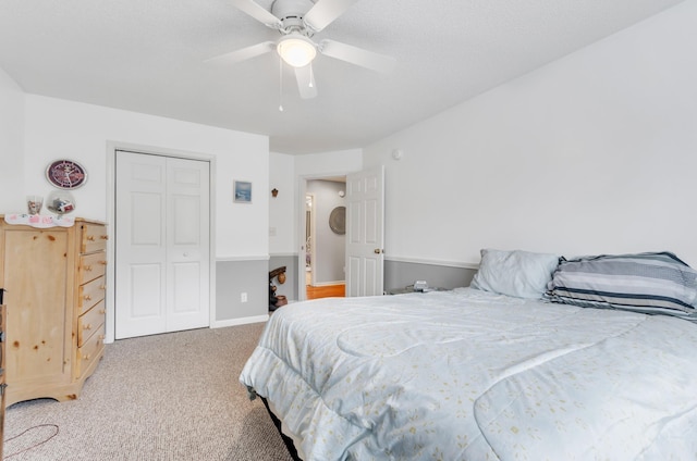 bedroom with carpet floors, a closet, and ceiling fan