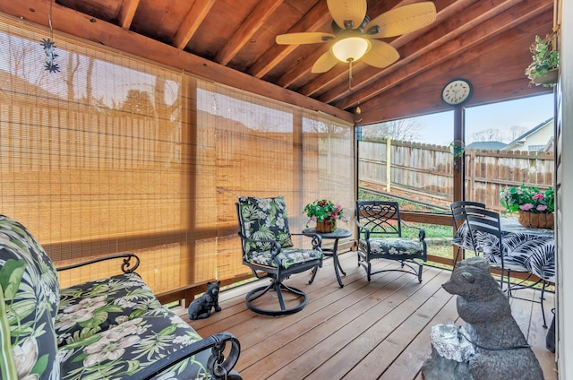 sunroom featuring ceiling fan, lofted ceiling, and wooden ceiling