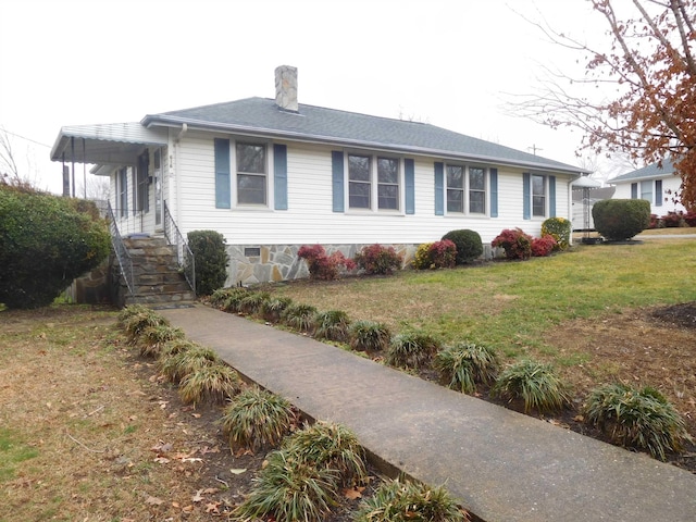 single story home with a front lawn