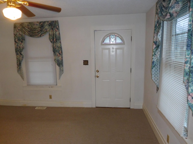 entrance foyer with ceiling fan