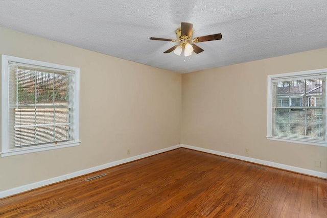 unfurnished room with hardwood / wood-style floors, a textured ceiling, and ceiling fan