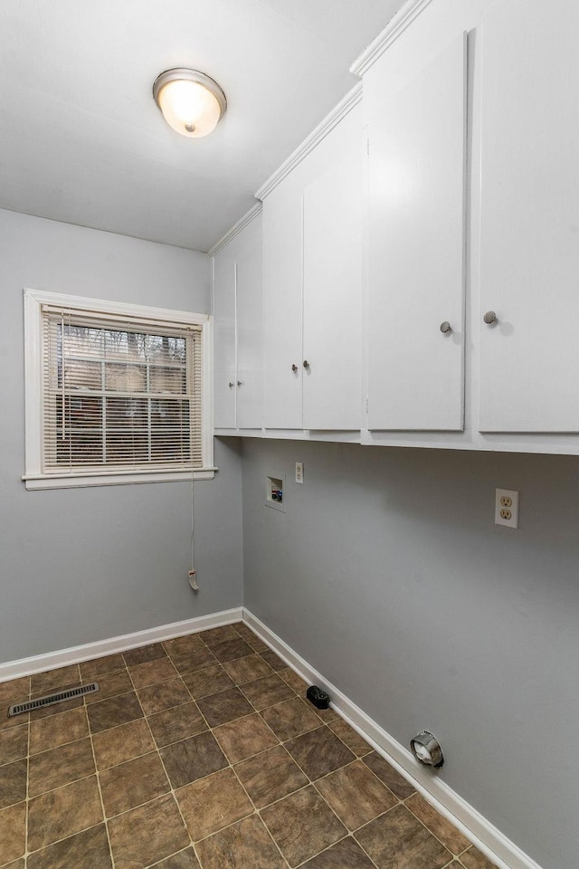 laundry area featuring cabinets and washer hookup