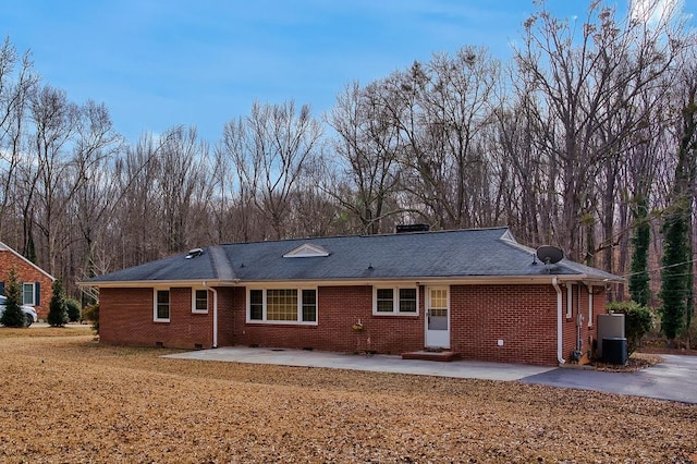 back of house featuring central AC unit and a patio