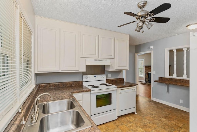 kitchen featuring white cabinetry, sink, white appliances, and ceiling fan