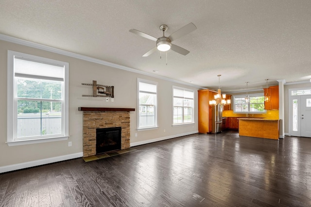 unfurnished living room with ornamental molding, dark hardwood / wood-style floors, and a textured ceiling