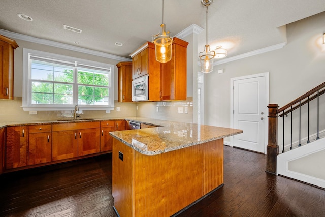 kitchen with sink, appliances with stainless steel finishes, backsplash, dark hardwood / wood-style floors, and decorative light fixtures