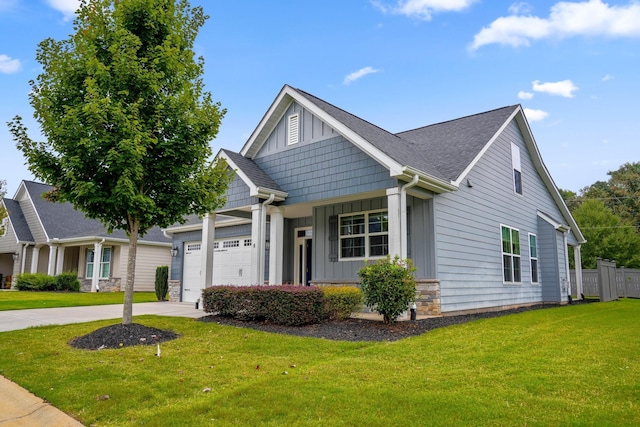 view of front facade with a garage and a front yard