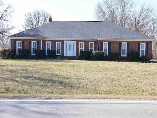 single story home featuring a front yard