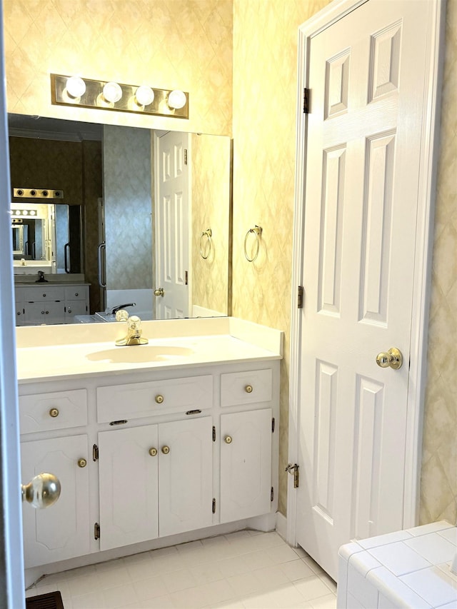 bathroom with vanity and tile patterned flooring