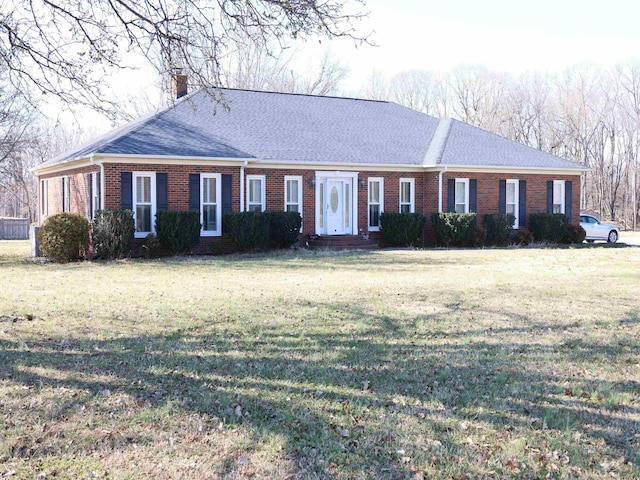 ranch-style home featuring a front yard