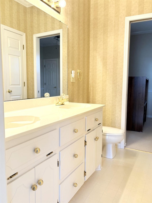 bathroom with vanity, toilet, and tile patterned flooring