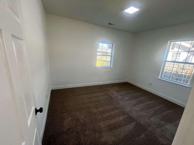 unfurnished room featuring carpet