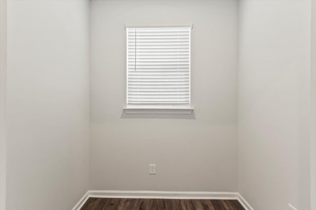 empty room featuring dark wood-type flooring