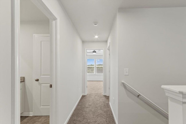 corridor with light colored carpet