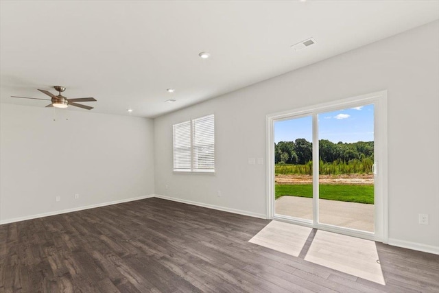 unfurnished room with dark hardwood / wood-style floors and ceiling fan