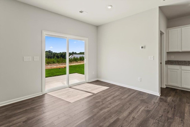 unfurnished dining area with dark hardwood / wood-style floors