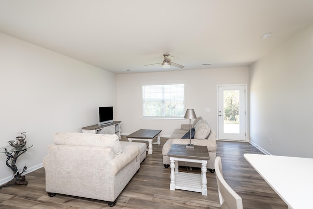 living room with hardwood / wood-style flooring and ceiling fan