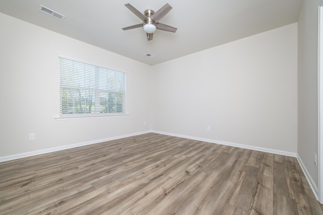 unfurnished room featuring ceiling fan and light hardwood / wood-style floors