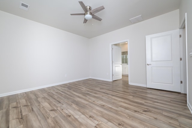 unfurnished room featuring light hardwood / wood-style flooring and ceiling fan