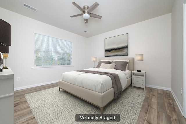 bedroom featuring wood-type flooring and ceiling fan