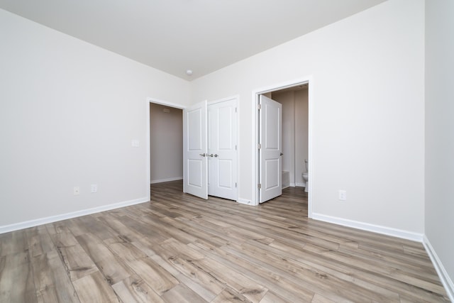 unfurnished bedroom featuring light wood-type flooring