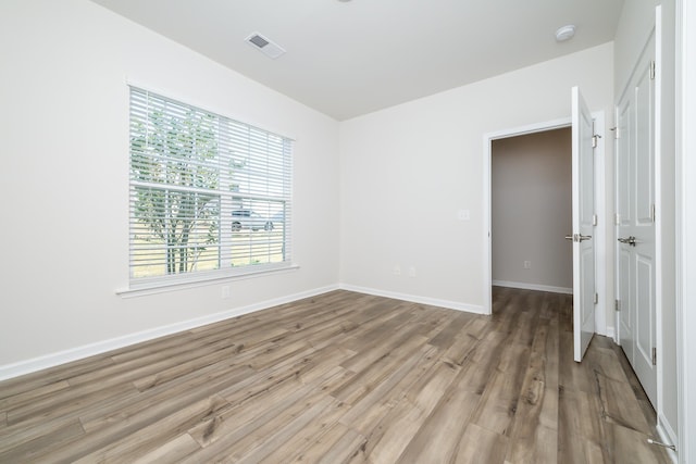 spare room with light hardwood / wood-style floors