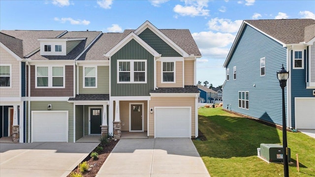 view of front of home with a garage and a front yard