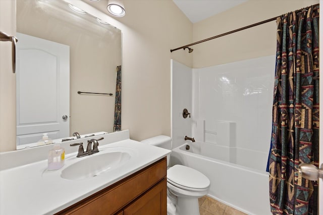 full bathroom featuring vanity, shower / bath combo with shower curtain, and toilet