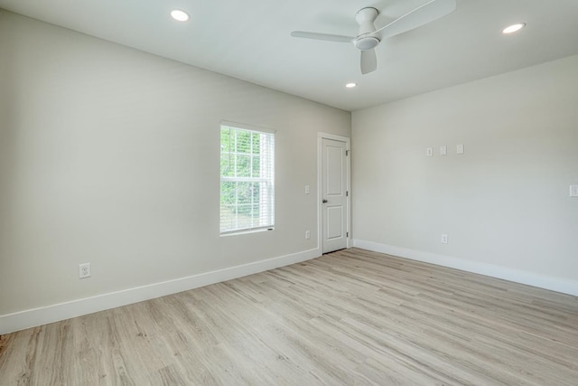 unfurnished room with ceiling fan and light hardwood / wood-style floors